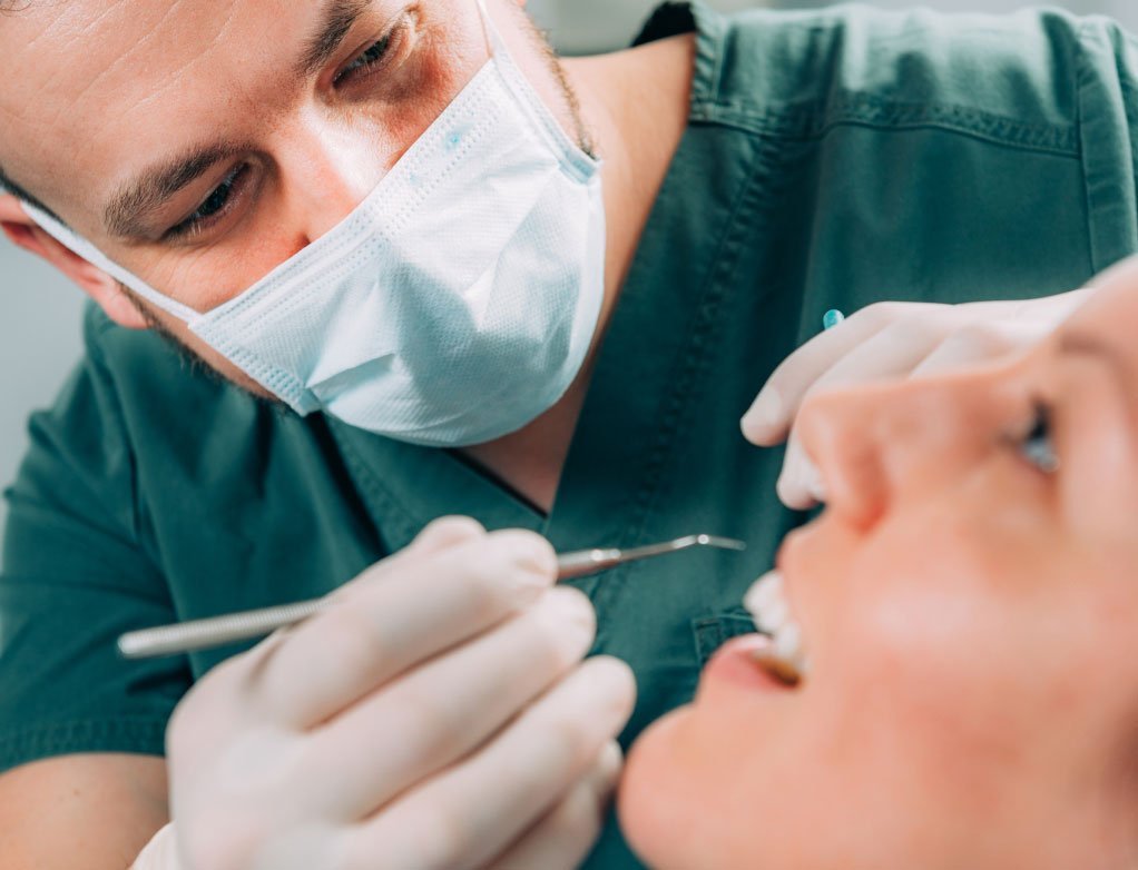 examining teeth and dental implants